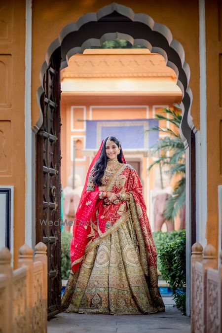 Photo of Bride wearing a heavy lehenga double dupattas.