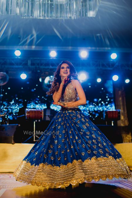 Photo of Happy bride dancing on sangeet shot