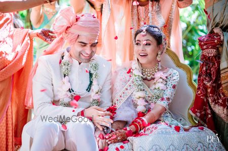 Photo of Candid shot of couple during jaimala