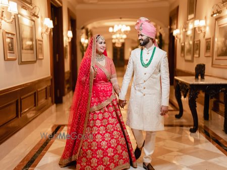 Photo of Bride and groom in traditional wedding outfits