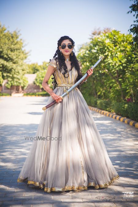 Photo of Bride holding sword