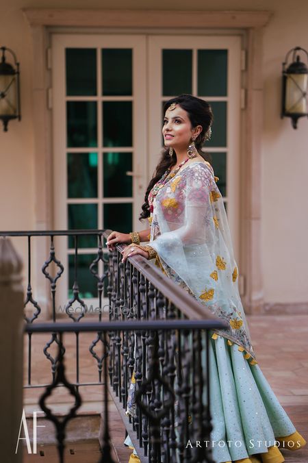 Photo of Light blue lehenga for mehendi with mustard border