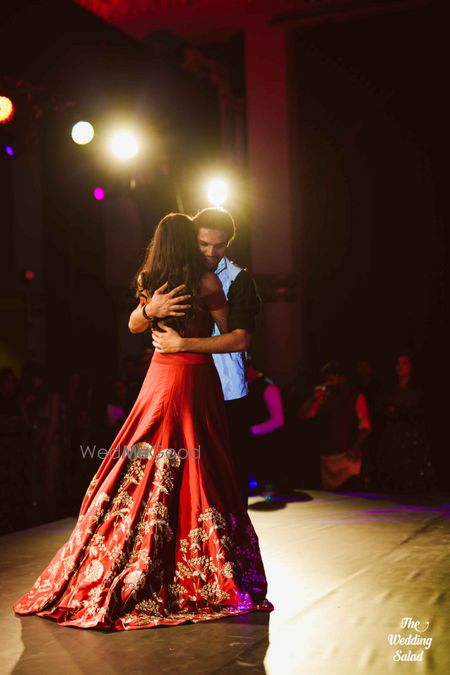 Photo of red silk lehenga with train