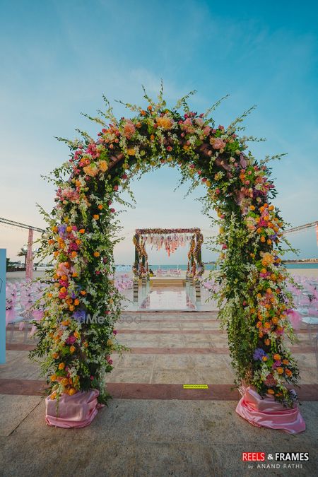 Photo of A floral archway decor with fresh flowers for a day wedding