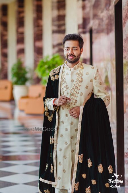 Photo of Offwhite sherwani with black velvet dupatta