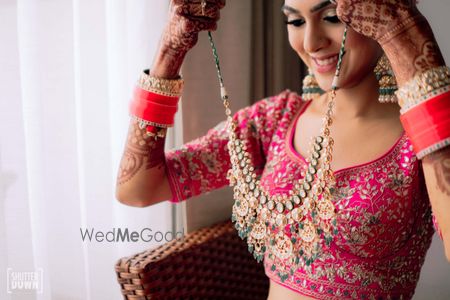 Photo of A getting ready shot of the bride with her jewellery