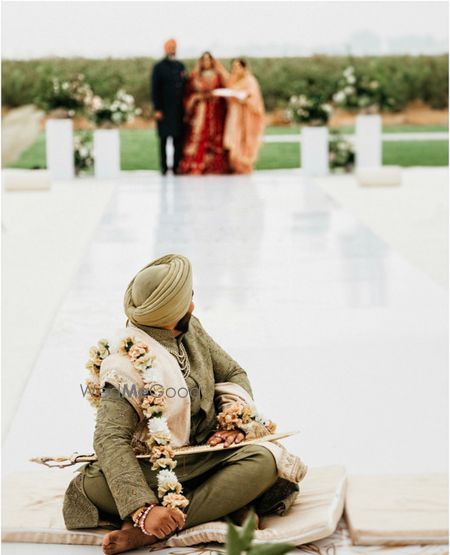 Photo of cute groom looking at the bride shot