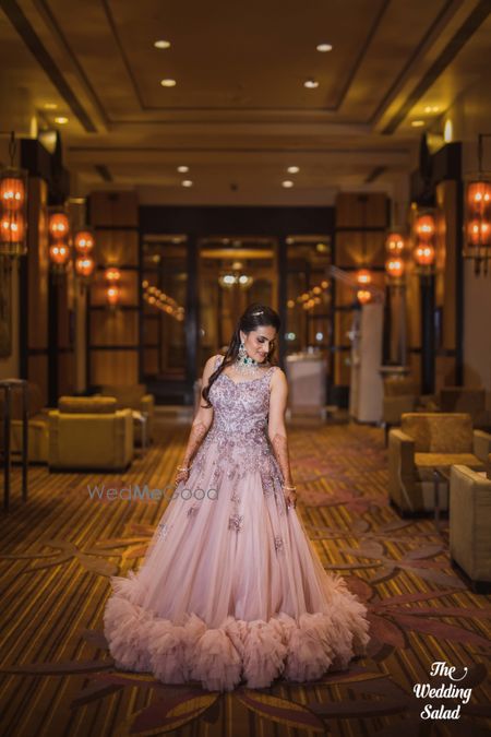 Photo of Light pink ruffled gown for cocktail