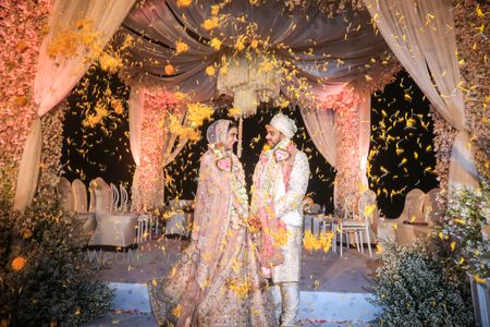 Photo of Newly married! A bride and groom lovingly looking at each other right after they tied the knot.