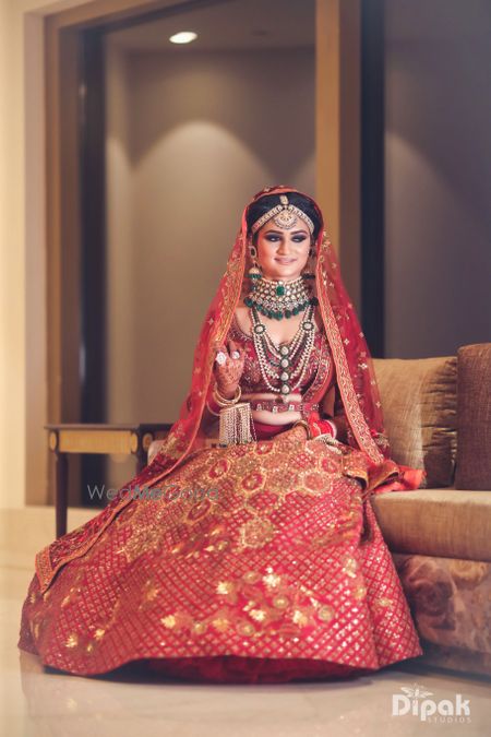 Photo of Bridal portait in red and orange lehenga