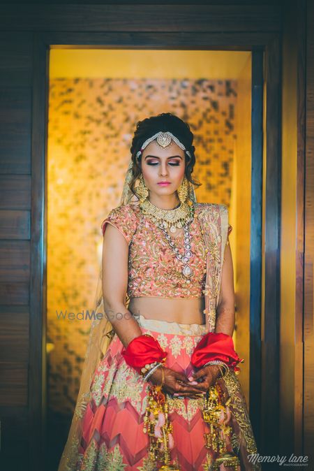 Photo of Peach bridal lehenga with gold