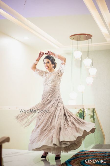 Photo of Reception gown in silver with tassels