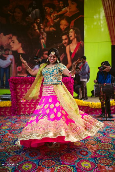 Photo of Fuschia pink lehenga in neon colors for mehendi