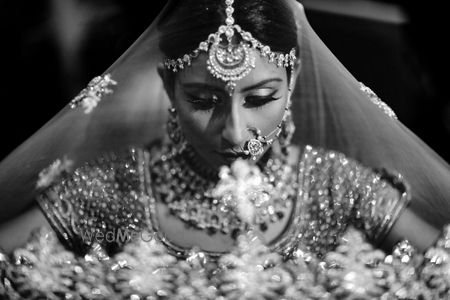 Photo of Classic bridal portrait in black and white with dupatta as veil