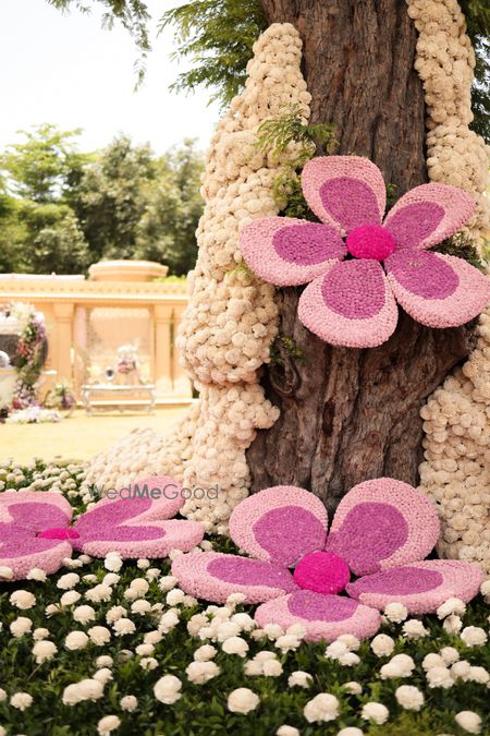 Photo of Statement floral decor with different shades of pink for an outdoor event