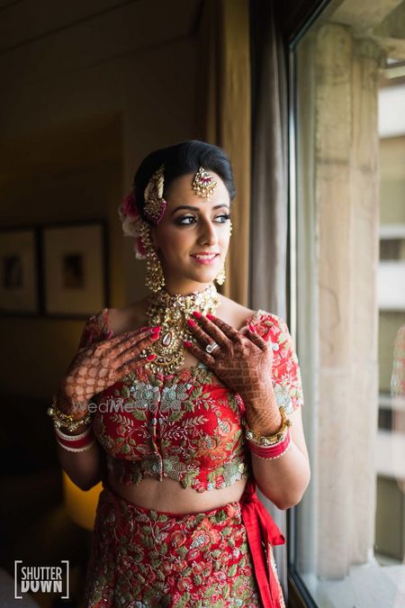 Photo of Bridal getting ready portrait with floral blouse