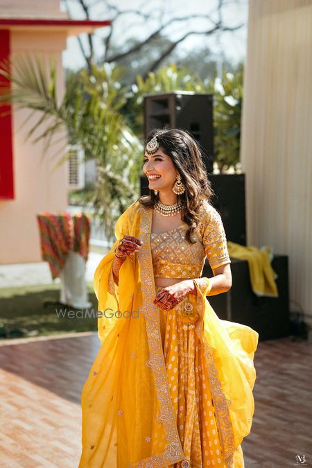 Photo of Bright yellow mehendi lehenga