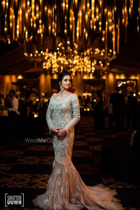 Photo of White and peach cocktail gown with train