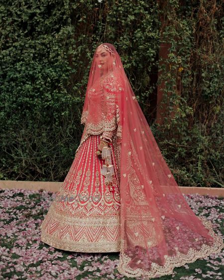 Photo of bride in pink lehenga