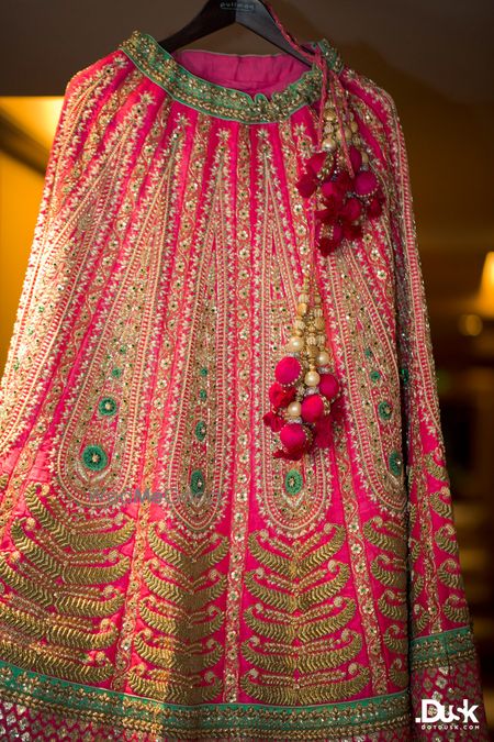 Photo of bright pink and turquoise lehenga