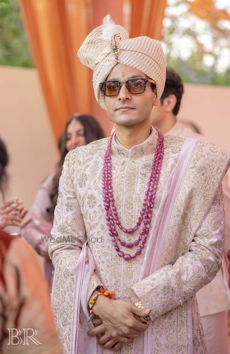 Photo of Heavy embroidered sherwani with ruby necklace for groom.