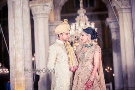 Photo of Matching bride and groom in coordinated outfits