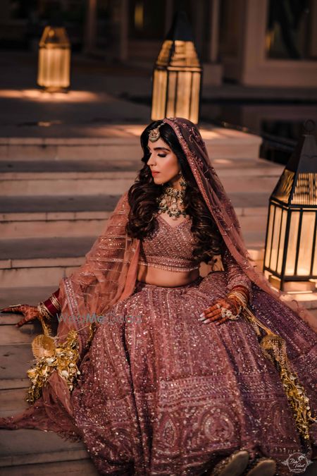 Photo of offbeat bridal look with onion pink lehenga and open hair