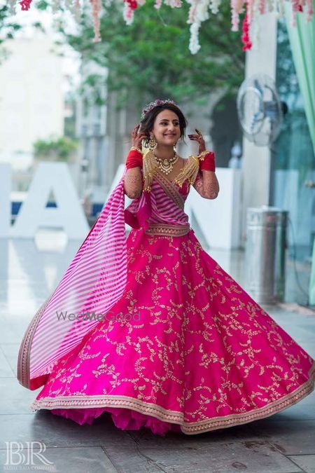 Photo of Bright pink sabysachi lehenga for mehendi