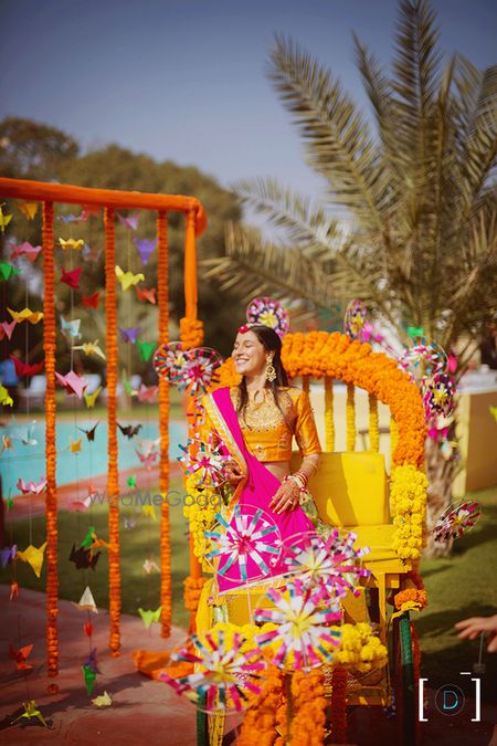 Photo of Happy bride entering on rickshaw during mehendi