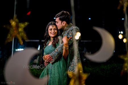 Photo of Cute couple portrait at the sangeet