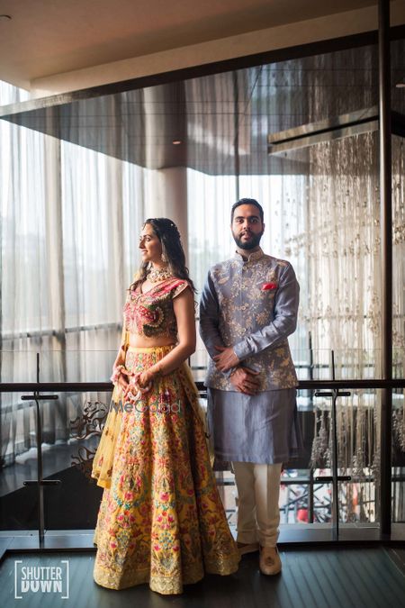 Photo of Couple mehendi portrait in offbeat colours