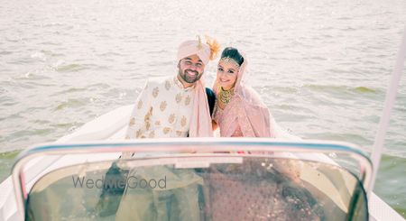 Photo of Couple entering idea on speedboat