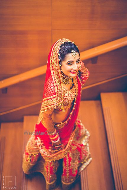 Photo of red and gold bridal lehenga