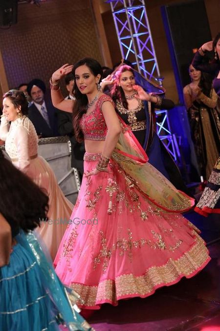 Photo of light pink net lehenga flared