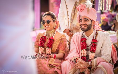 Photo of A couple in coordinated pastel outfits.