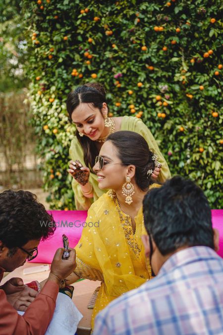 Photo of Candid bridal shot during mehendi