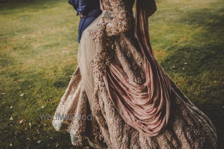 Photo of Exquisite bridal lehenga with soft pink details