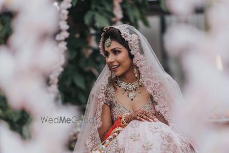 Photo of A beautiful bridal portrait of the bride during the ceremony