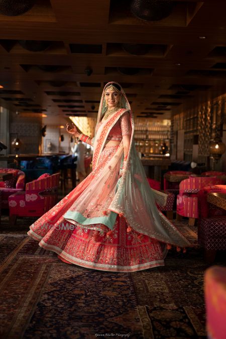 Photo of Anita dongre bridal lehenga in red and green