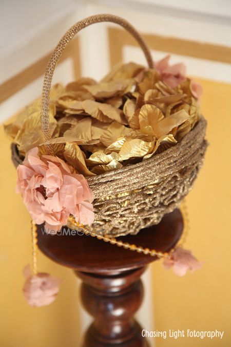 Photo of Basket with Gold and Pink Origami Flowers and Leaves