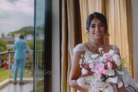 Photo of A Christian bride holding a floral bouquet