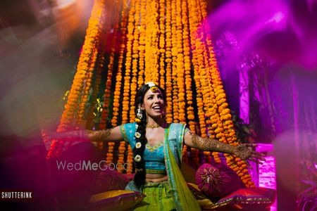 Photo of Happy bride on mehendi shot