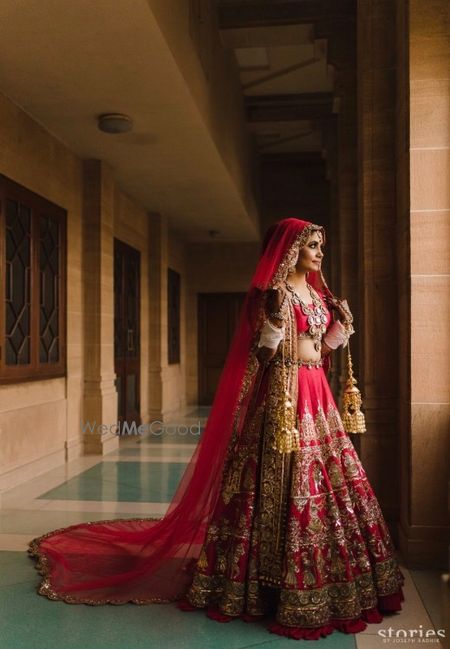 Photo of Red manish malhotra lehenga with a train dupatta