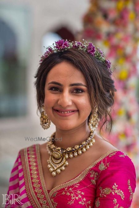 Photo of Mehendi hairstyle with floral wreath