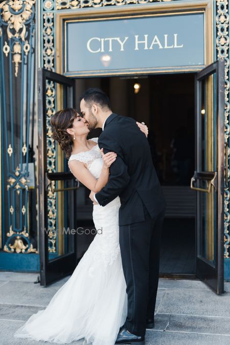 Photo of Couple kissing shot in front of city hall