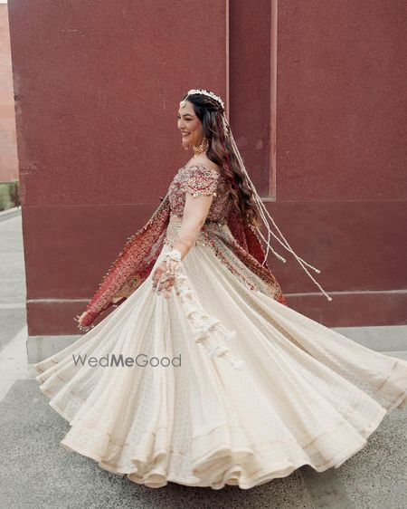 Photo of bride twirling in her haldi lehenga