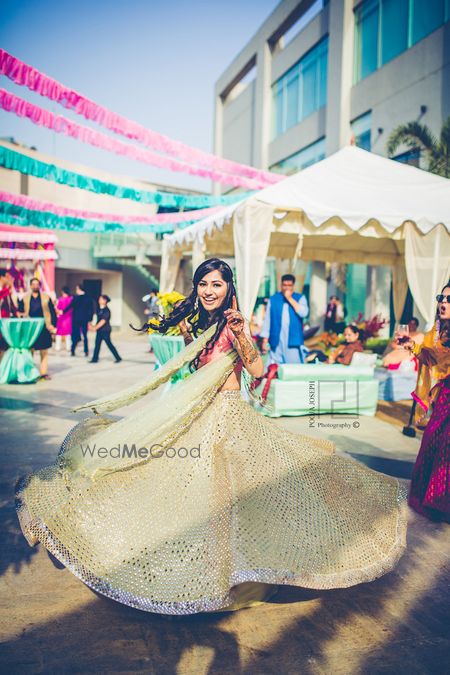 Photo of Mehendi twirling bride shot