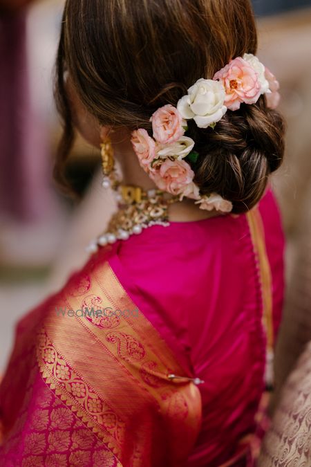 Photo of bridal bun with flowers for a nikaah