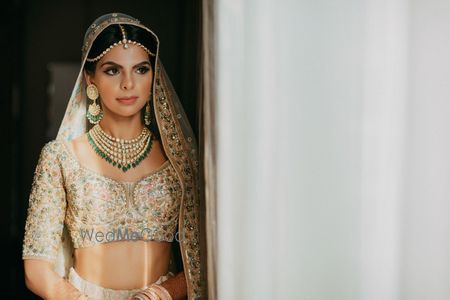 Photo of Ivory floral embroidery bridal lehenga Sabyasachi