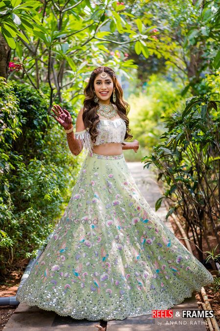 Photo of Bridal mehendi look in cold shoulder blouse and light green lehenga